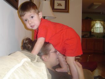 Caden climbing on Mommy