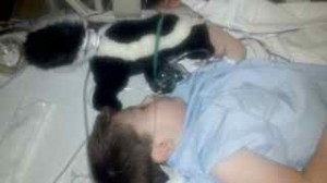 Caden and his favorite hospital buddy - Skunk