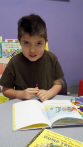 Caden reading in MUSC Peds Cardiology waiting room