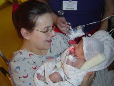 Sherry holds Caden for the first time